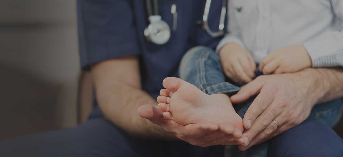 Doctor examining a child's foot